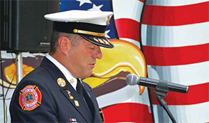Lawrence Fire Department Chief Brian Moriarty recited The Eleventh of September, a poem authored by Roger J. Robicheau.